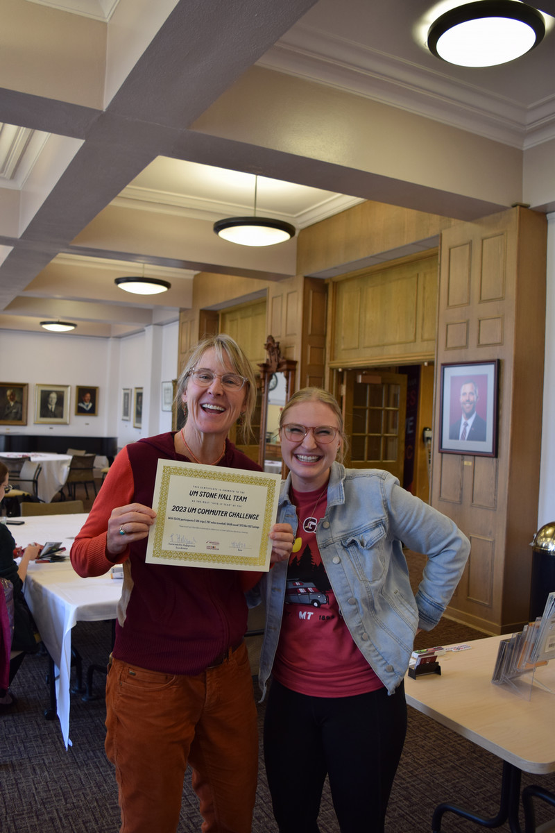 employees posing for picture at commuter event