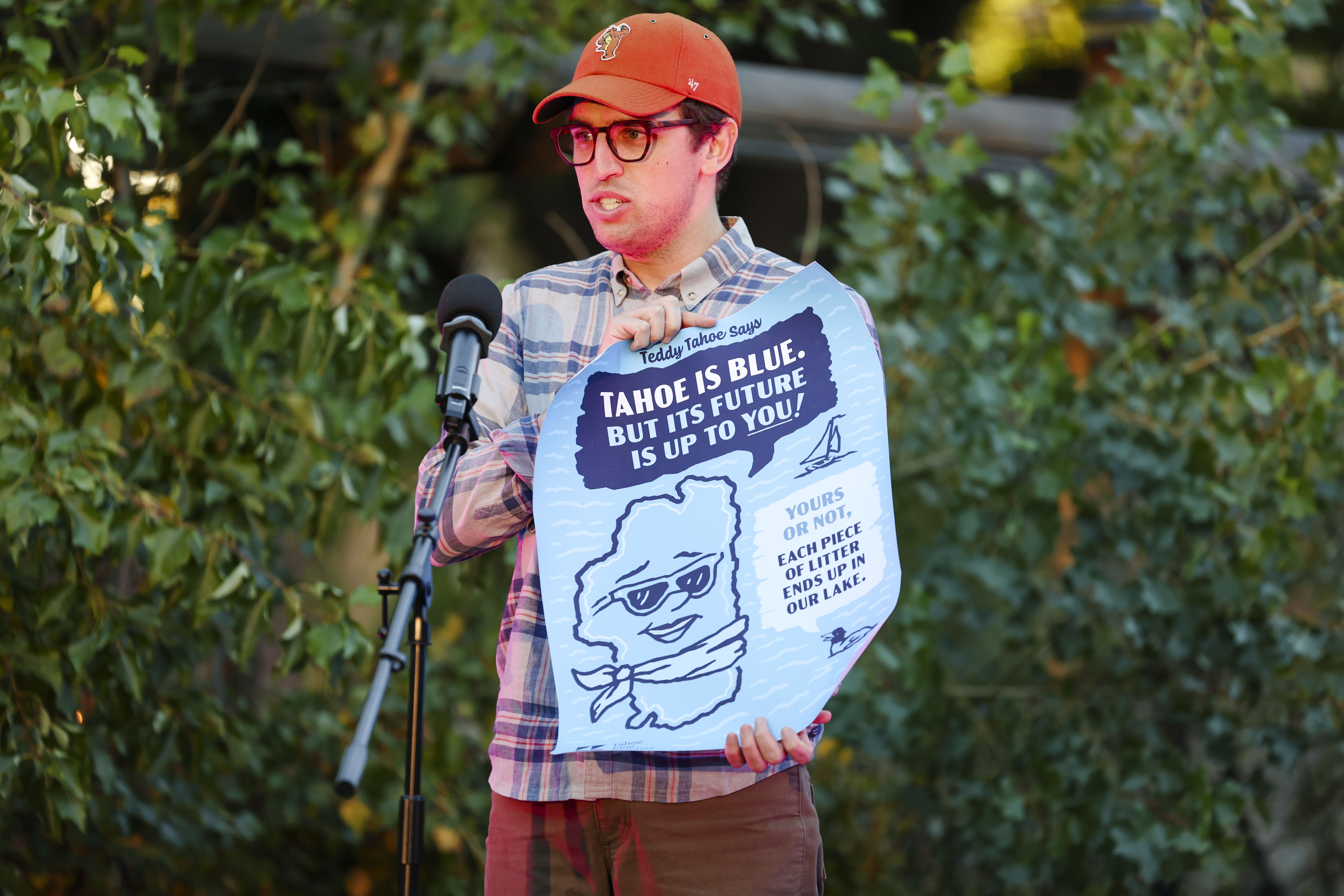 Professor Will Rice completes his slam with his poster he created to raise awareness of pollution at lake Tahoe