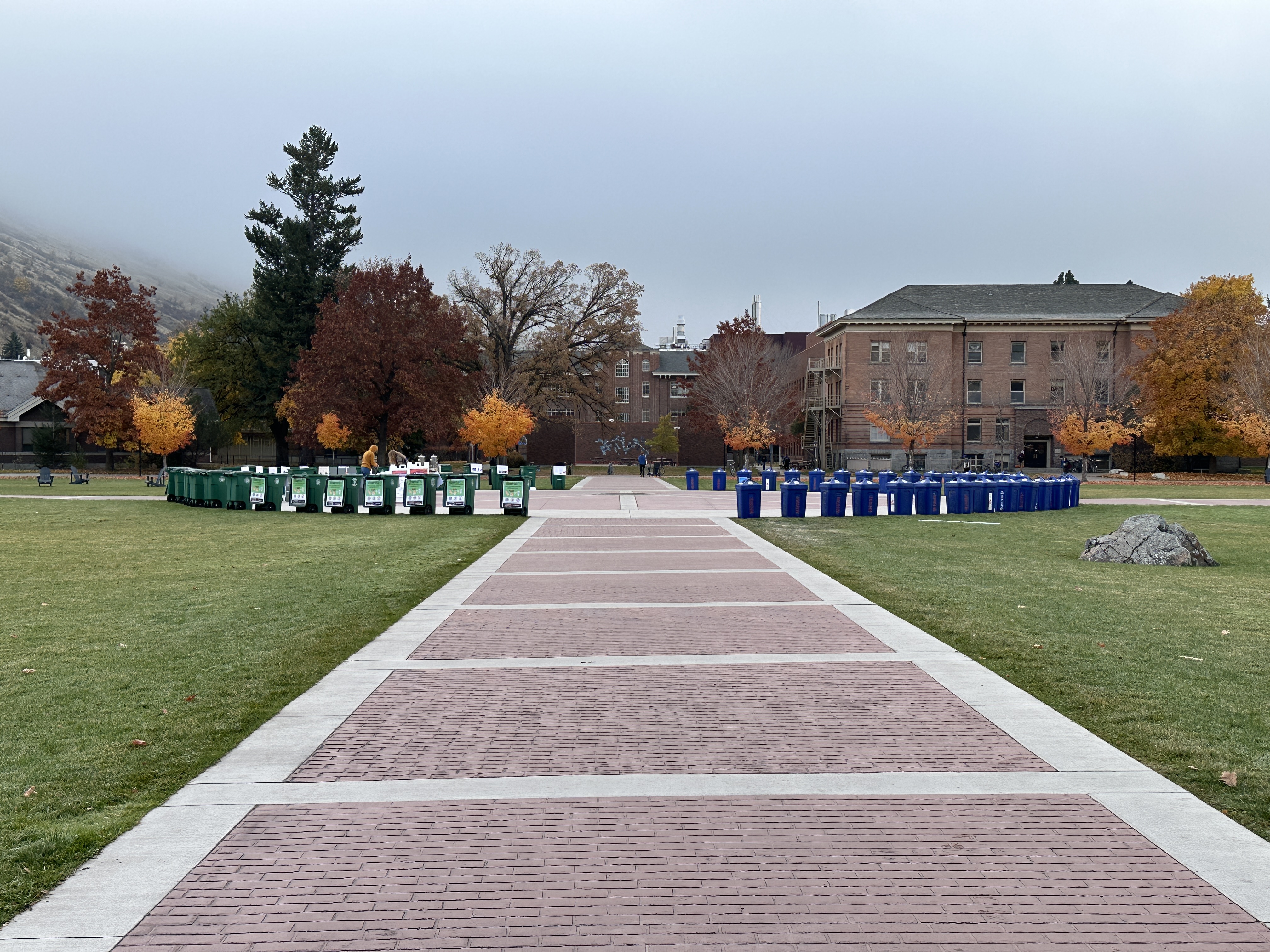 a circle of recycling and compost bins on the center of the oval