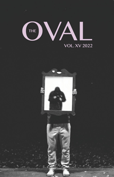 Volume 15 cover featuring a black and white photo of a person holding a large frame in front of their torso and face.