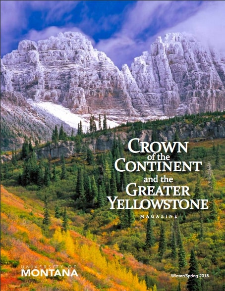 magazine cover featuring a colorful, tree covered hill in front of large snowy mountains