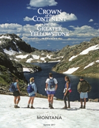 magazine cover featuring a group of five hikers on a snowy hill overlooking a lake