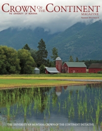 magazine cover featuring a red barn and silo in front of a pond