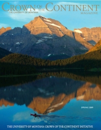 magazine cover with a mountain reflected in a lake with a kayaker going by