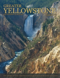 magazine cover featuring a large waterfall and river in a steep rocky canyon