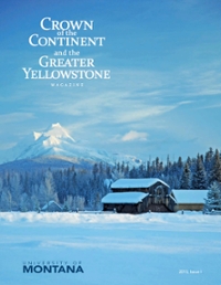 magazine cover showing a snow covered barn in front of trees and a large snowy mountain