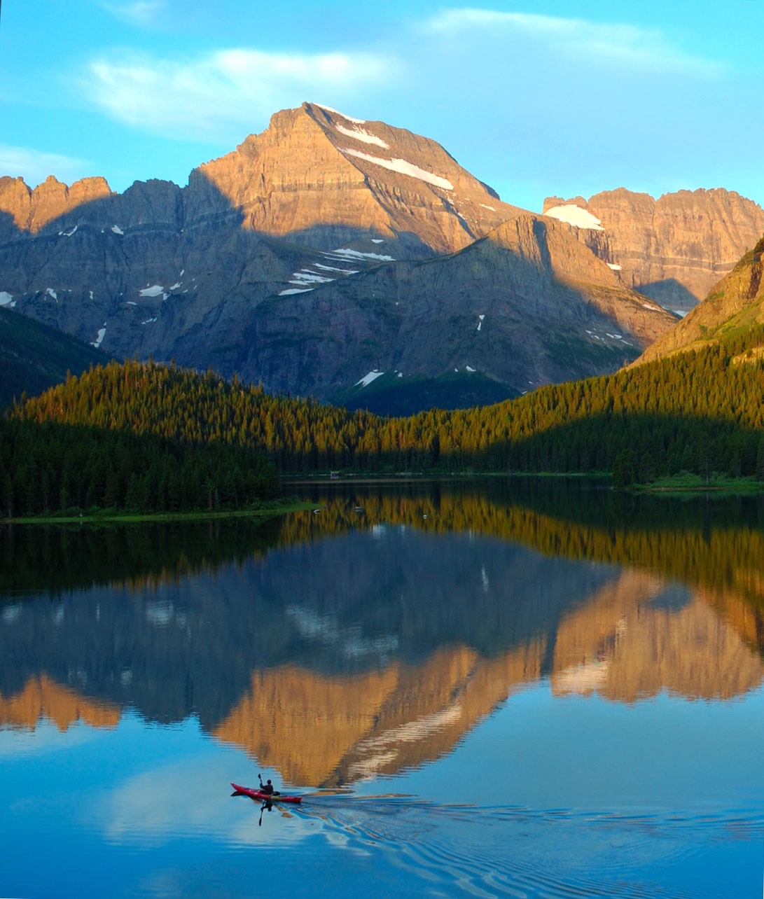 Swiftcurrent Lake in Glacier National Park mirrors Mount Gould and the Continental Divide