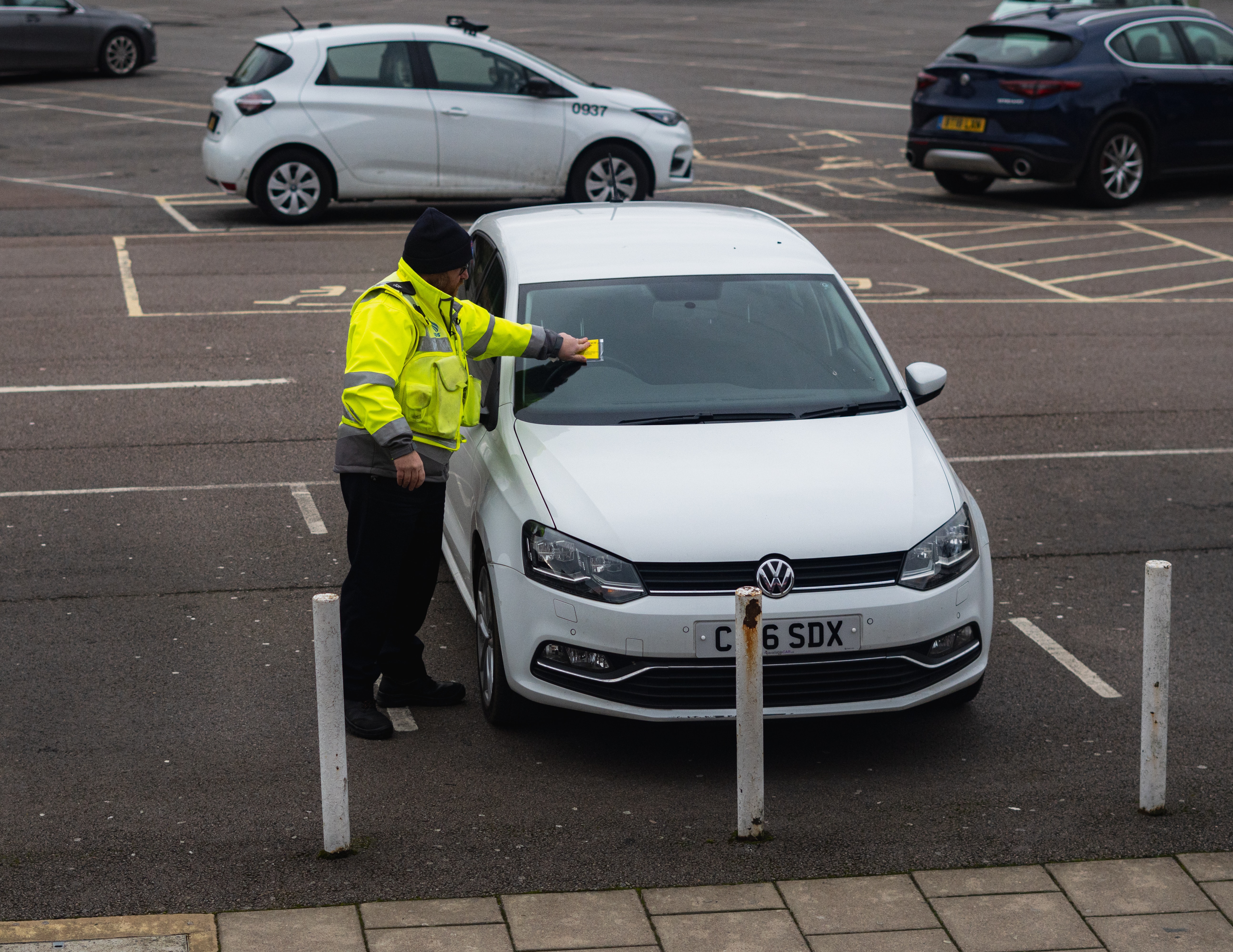 man-giving-parking-ticket.jpg