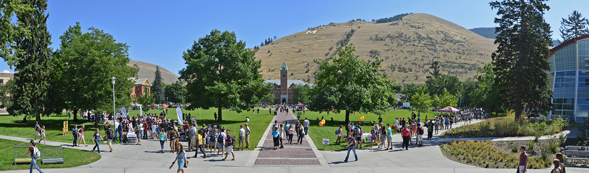 the central oval on the UM campus busy with students in the early fall