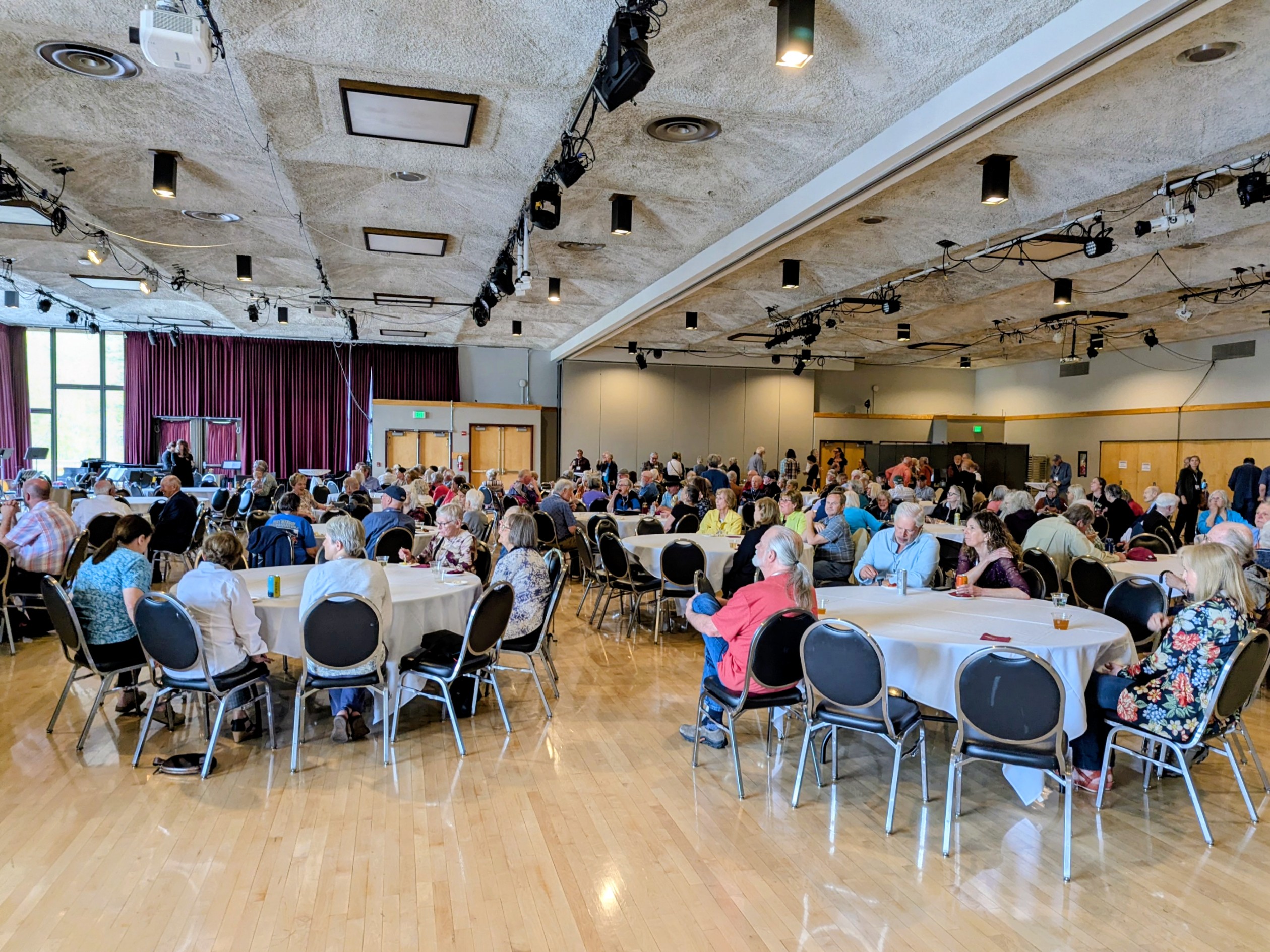 people sitting at tables for the 20th event