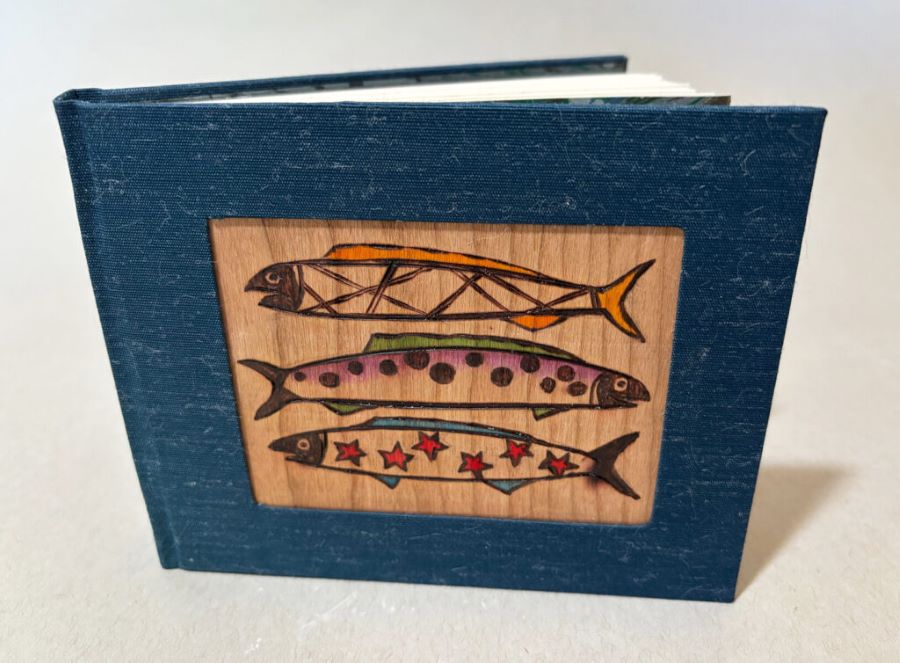 An image of Gallagher's hand bound, wood burned book cover.