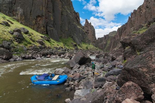raft on the rocky shore of a river