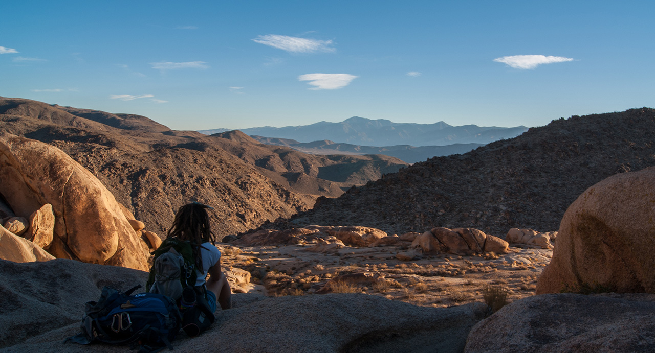 Person sitting in the desert