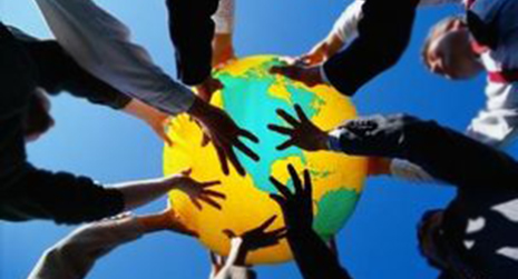 many hands holding a globe